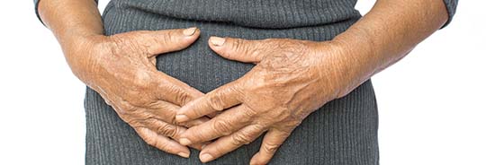 photo of person holding their stomach