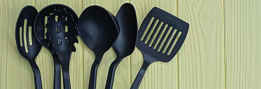 a-set-of-six-black-plastic-kitchen-utensils